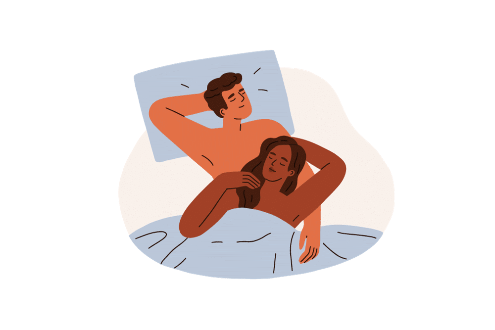 Couple in bed engaging in skin on skin contact.
